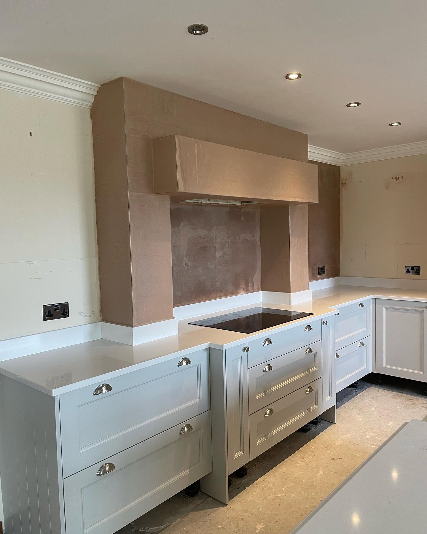 Kitchen chimney breast after plastering, smooth finish