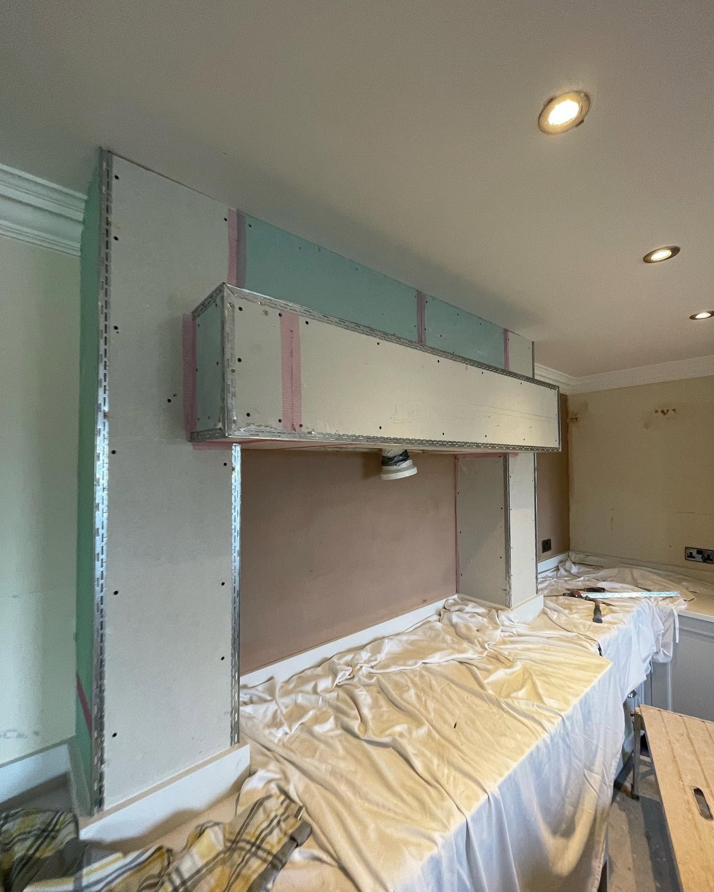 Kitchen chimney breast before plastering, bare plasterboard
