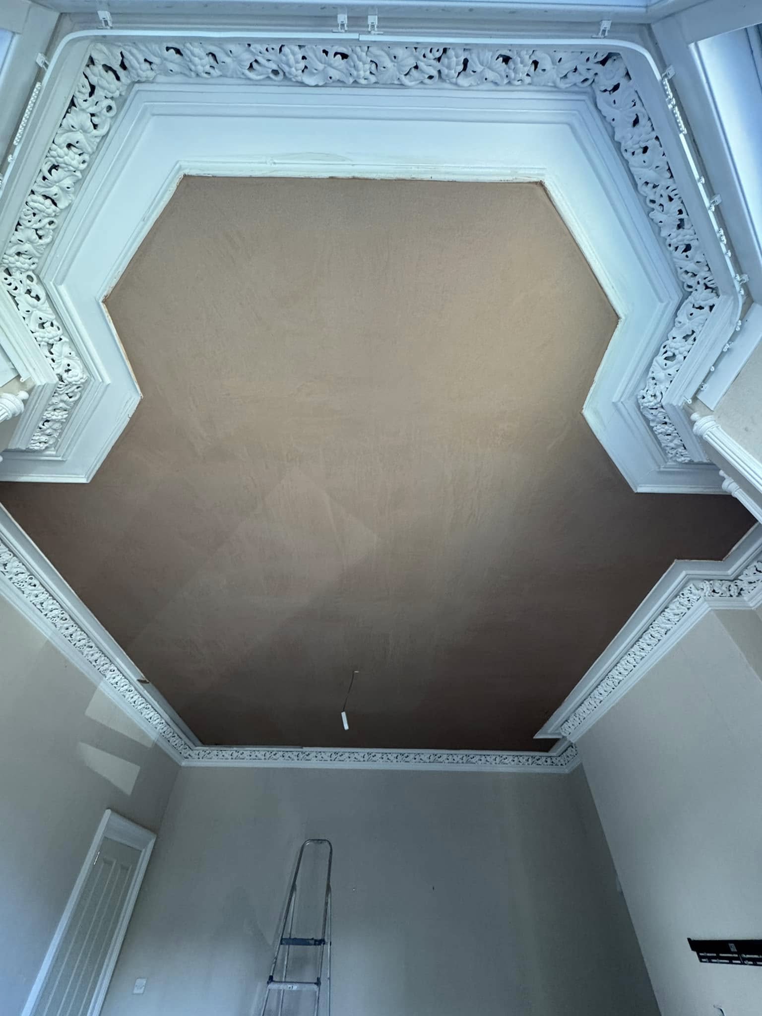 Kitchen walls after skimming, smooth painted finish